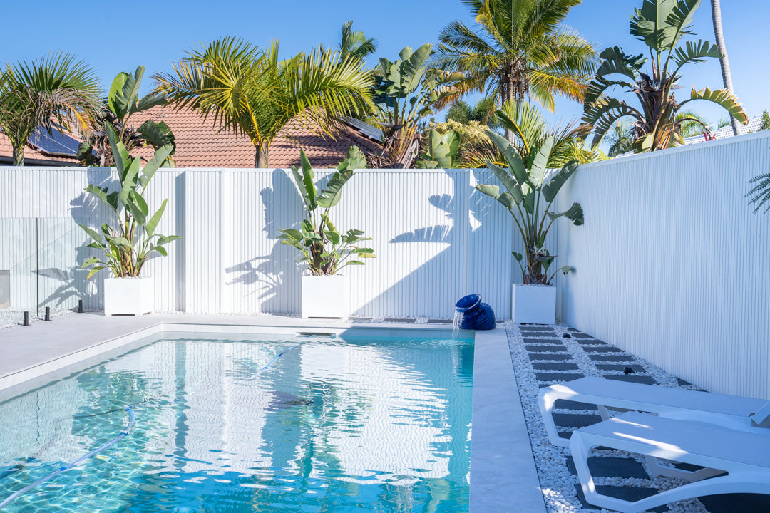 White outdoor pool fence