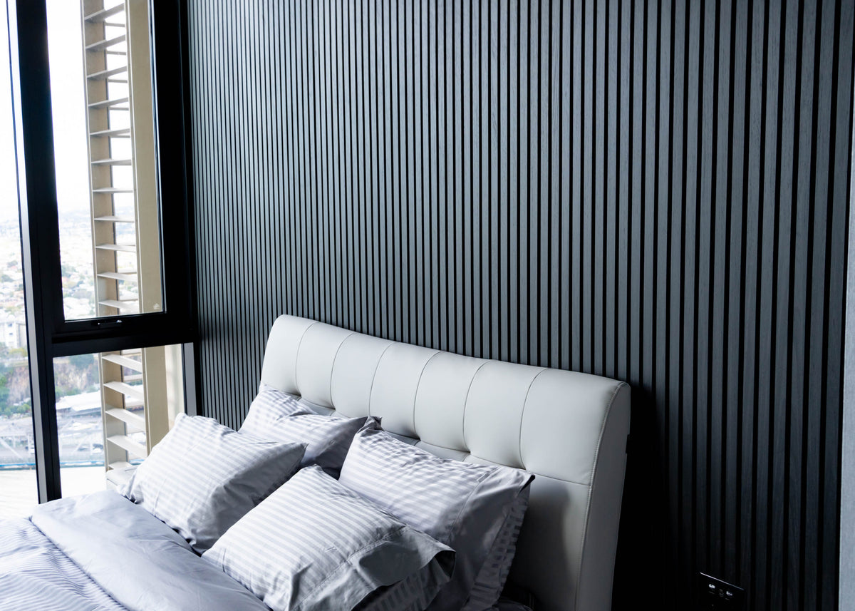 Black slats behind the bed